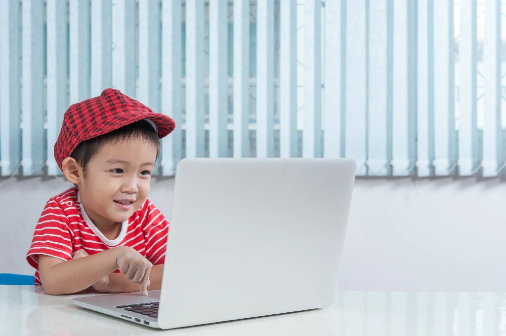 cute-boy-playing-laptop-children-s-room